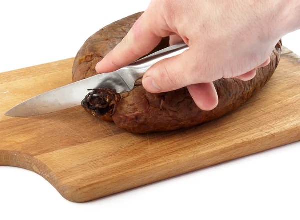 Hands cutting sausage — Stock Photo, Image