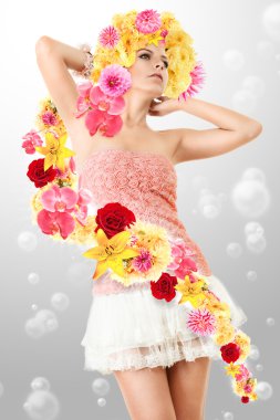 Young girl in pink clothing with flowers clipart