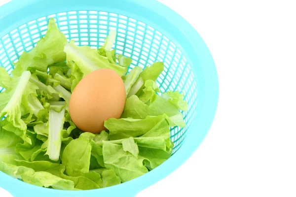 Egg on vegetable basket on white background. — Stock Photo, Image