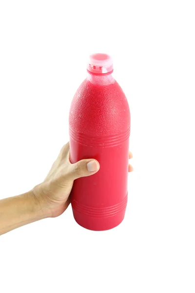 Rött vatten flaska i handen på vit bakgrund. — Stockfoto