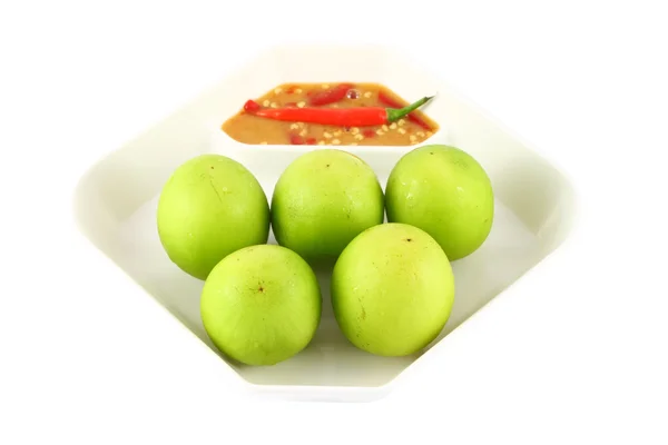 Green monkey apple on square plate. — Stock Photo, Image