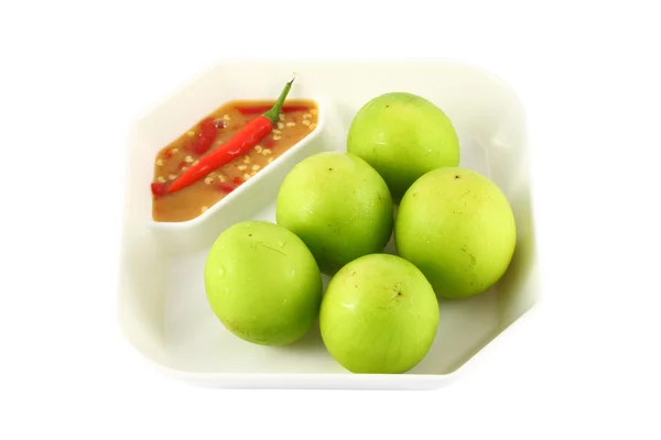 Green monkey apple on square plate — Stock Photo, Image