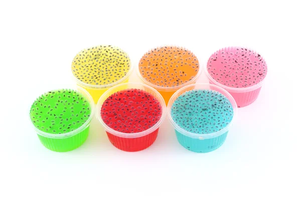 Gelatine multiple e basilico dolce in tazza di plastica . — Foto Stock