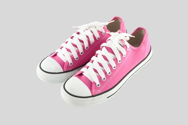 Sapatos esportivos rosa no fundo cinza . — Fotografia de Stock
