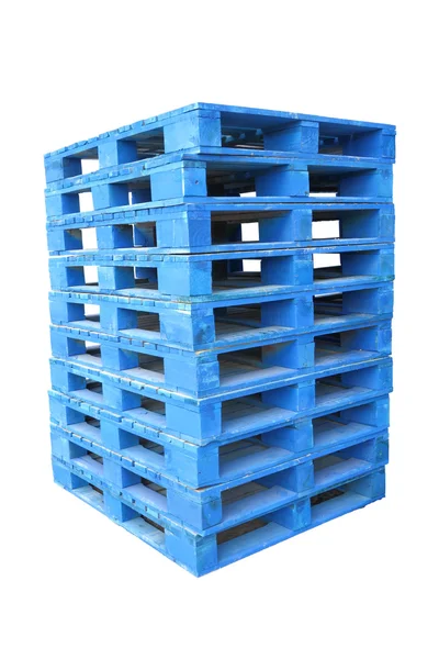 Pile di legno tavolozza blu su sfondo bianco . — Foto Stock