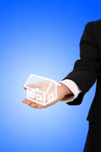 stock image Give house from business hand.