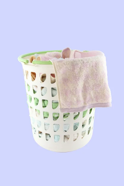 Basket of cloth hang before washing on blue background. — Stock Photo, Image