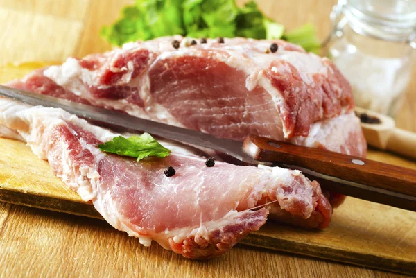 Raw meat on wooden board Stock Photo