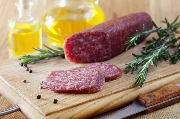 Sausage and rosemary — Stock Photo, Image
