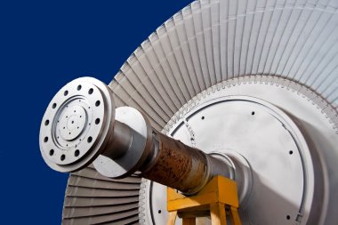 Wheel of rotor of steam-turbine on a support clipart
