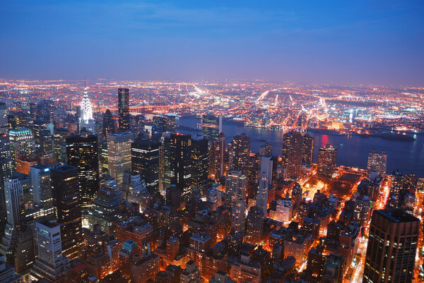 New York City Manhattan skyline aerial view panorama with Brooklyn and Hudson east river at sunset.