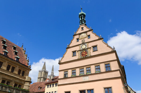Historic town hall and Meistertruk clock tower. Rothenburg is located Middle Franconia in Bavaria, Germany, well known for its well-preserved medieval old town, a destination for tourists from around the world.