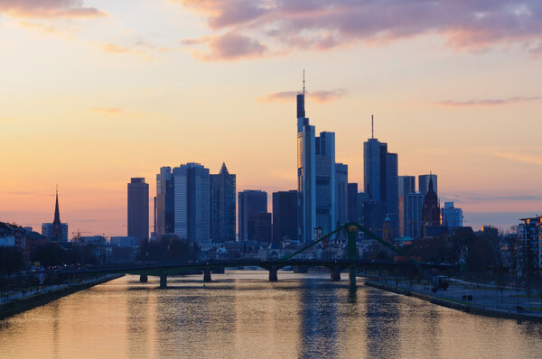 The view at sunset of the skyline of Frankfurt am Main from the Deutschherrn bridge.
