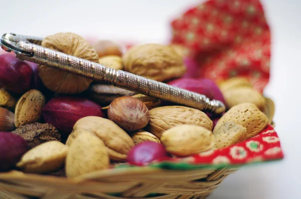 Nuts and a nut cracker — Stock Photo, Image