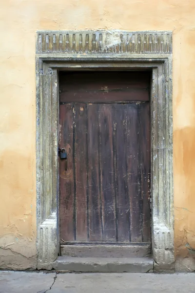 stock image Vintage wooden door with a padlock