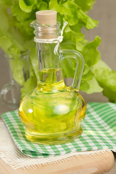 Oil on green napkin — Stock Photo, Image