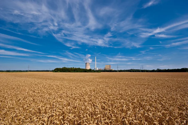 Grainfield and power plant — Stock Photo, Image
