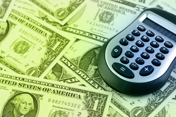 Calculator on cash — Stock Photo, Image