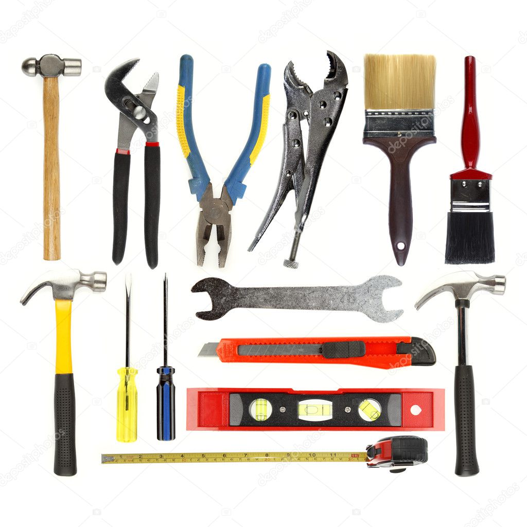 Varied tools on plain background