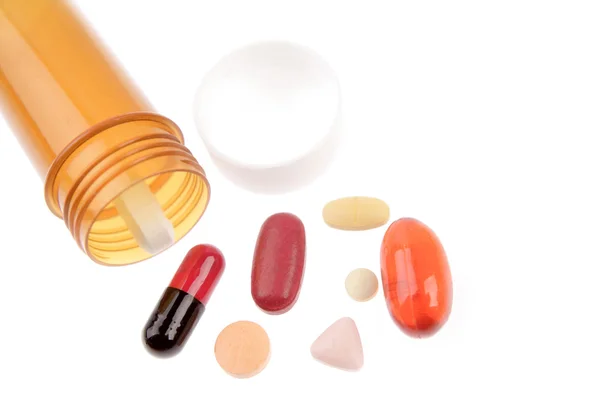 Çeşitli ilaçlar ve konteyner beyaz — Stok fotoğraf