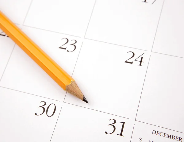 A naptári oldalala ceruza — Stock Fotó