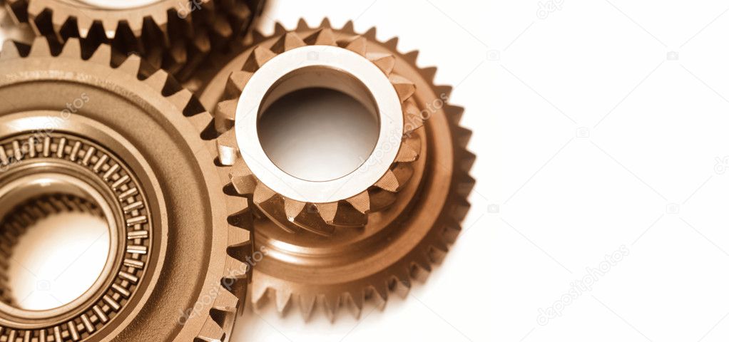 Closeup of steel gears meshing together