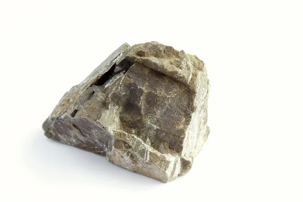 Closeup of rough rock on plain background — Stock Photo, Image