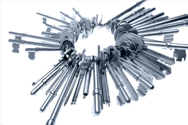 Bunch of keys on white — Stock Photo, Image