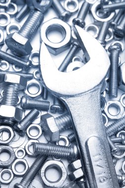 Wrench on nuts and bolts clipart