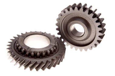 Two cogs connecting over white clipart