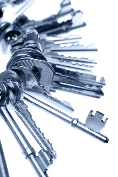 Bunch of keys on plain background — Stock Photo, Image