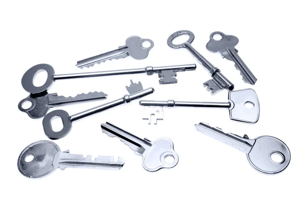 Assorted keys on plain background — Stock Photo, Image