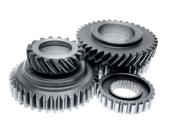 Metal cogs on plain background — Stock Photo, Image
