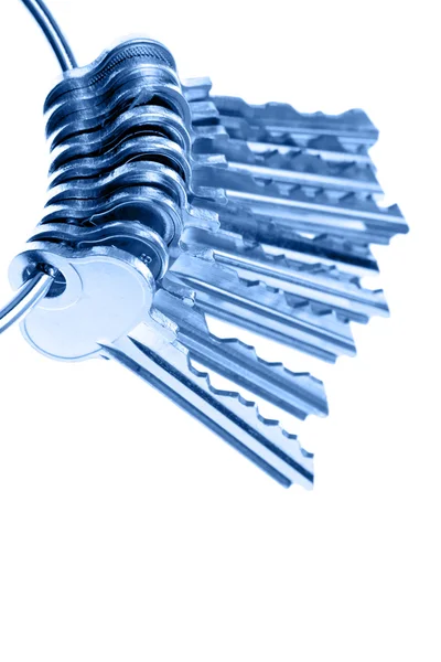 Bunch of keys on plain background — Stock Photo, Image