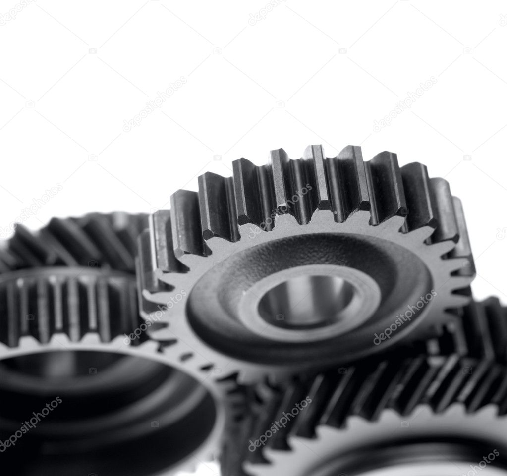 Closeup of steel gears meshing together