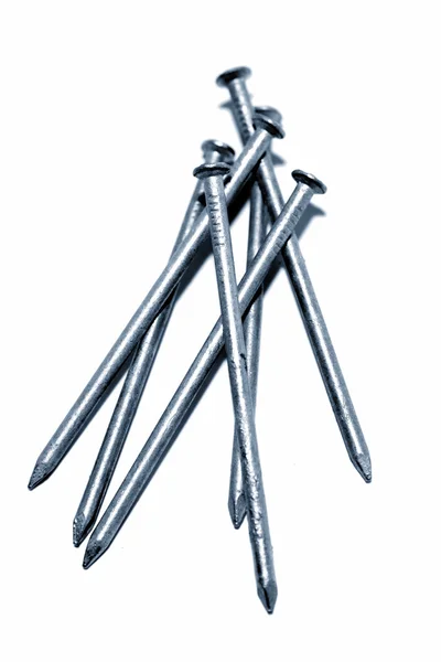Steel nails on plain background — Stock Photo, Image