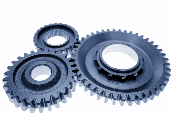 Three metal gears on plain background — Stock Photo, Image