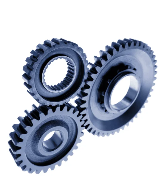 Three metal gears on plain background — Stock Photo, Image