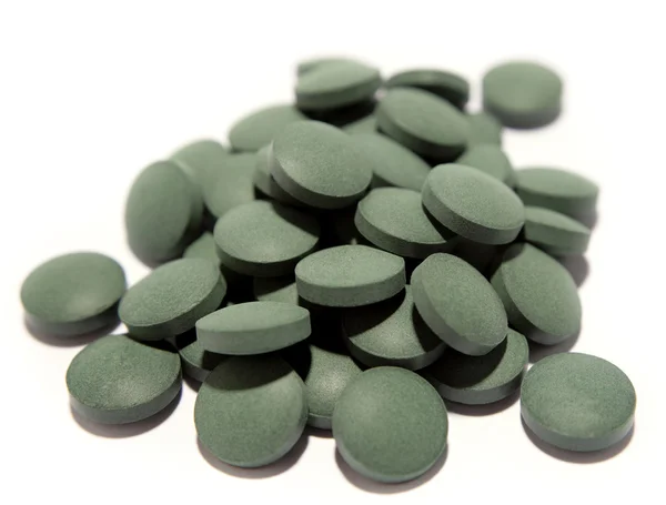 Pile of pills closeup on white — Stock Photo, Image