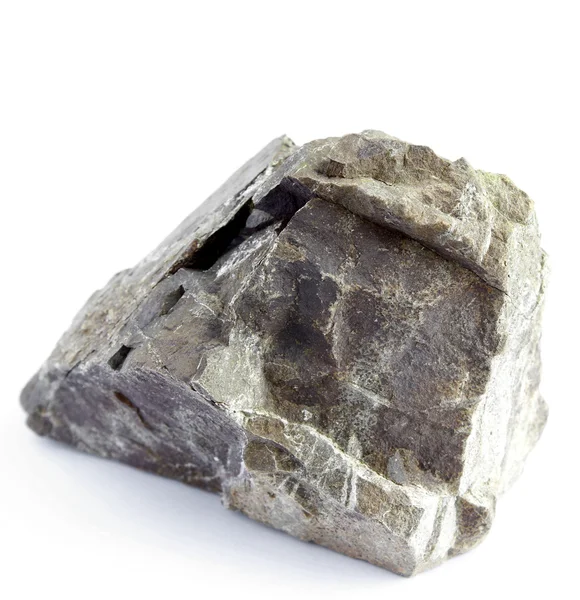 Pedra áspera no fundo liso — Fotografia de Stock