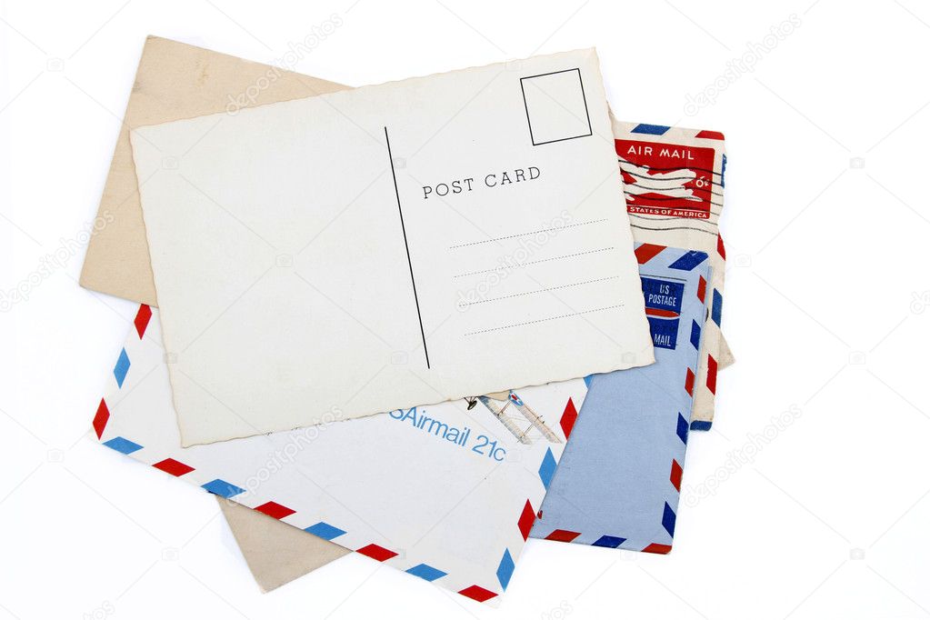 Postcard on pile of old air mail envelopes