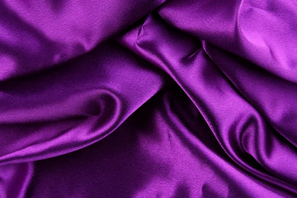 Fechar as dobras em tecido de seda roxa — Fotografia de Stock