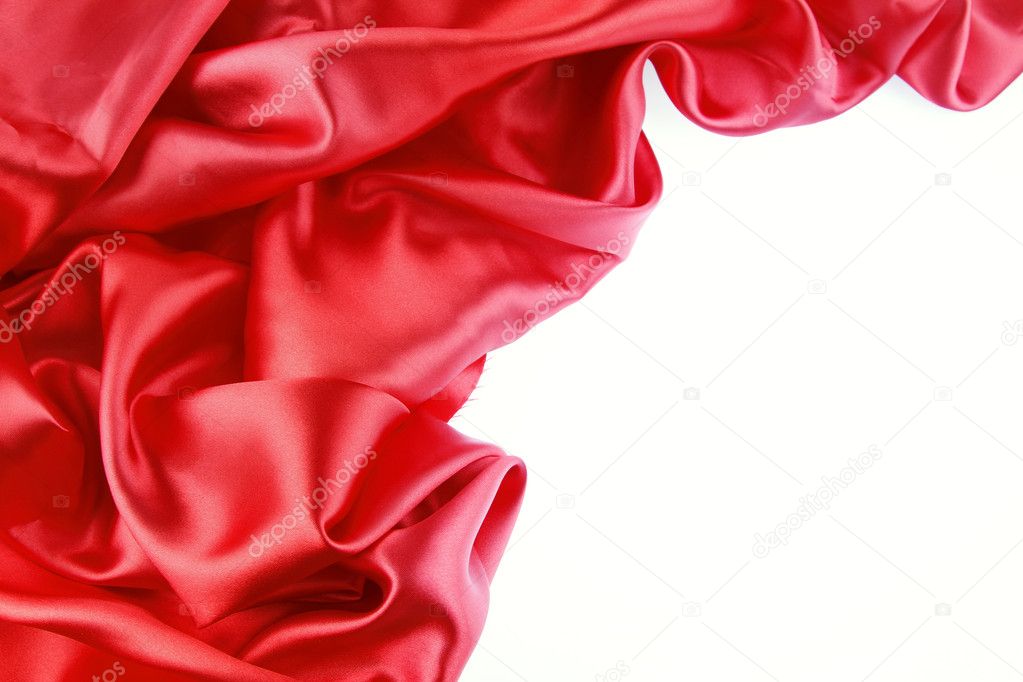 Red silk fabric on plain background
