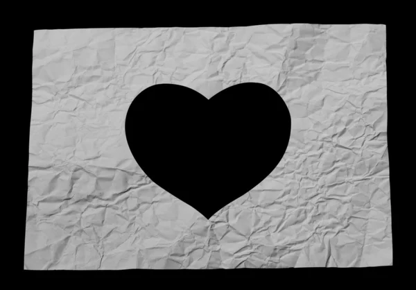 Kağıt üzerinde kalp şekli delik — Stok fotoğraf