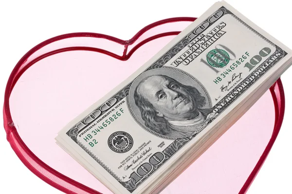 Dollars américains billets dans un coeur — Photo