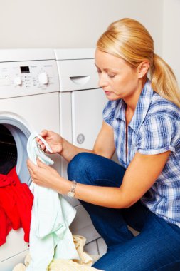 Housewife with washing machine clipart