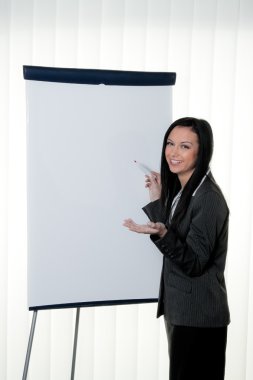 Coach before empty flipchart in training and education clipart