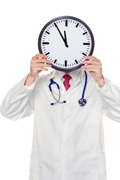 Доктор в голові перед напругою з годинником — стокове фото