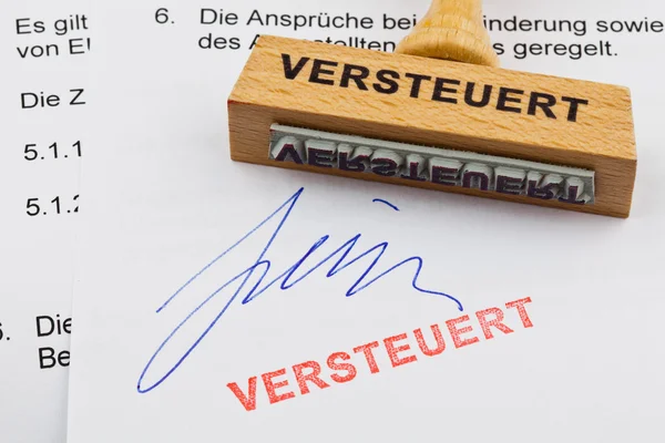 Wood stamp on the document: tax — Stock Photo, Image