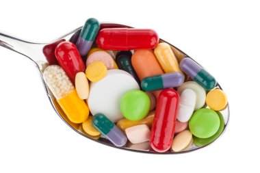 Tablets and medicines on spoon clipart